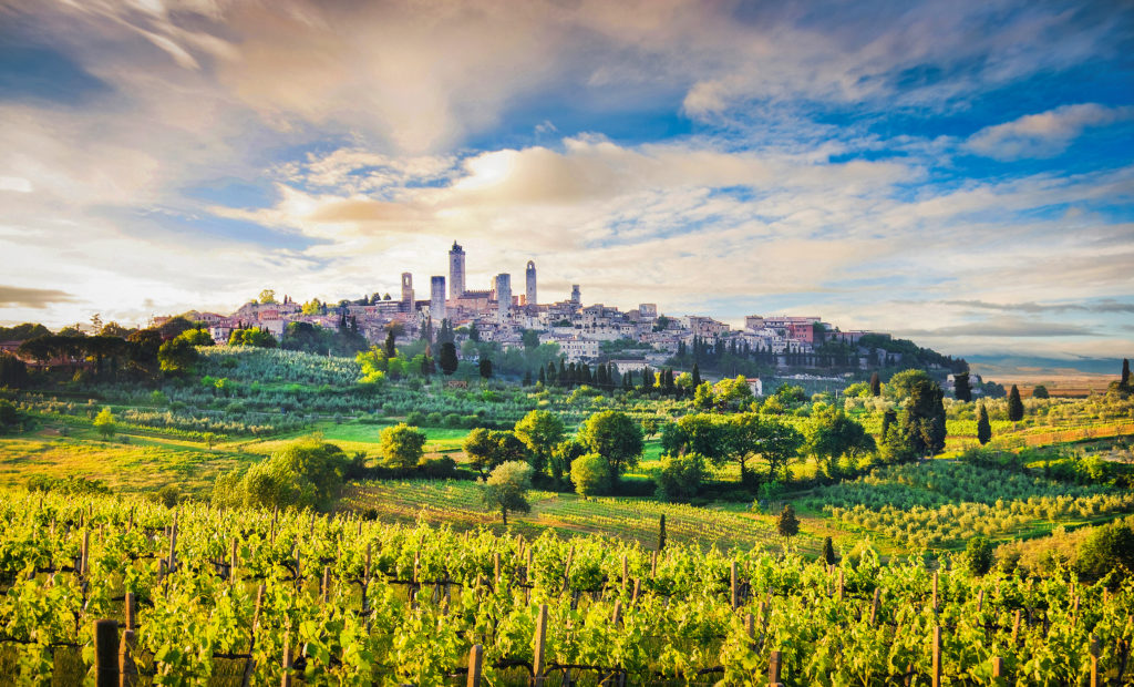 Panoramic view of San Gimignano across a valley in Tuscany, Italy
