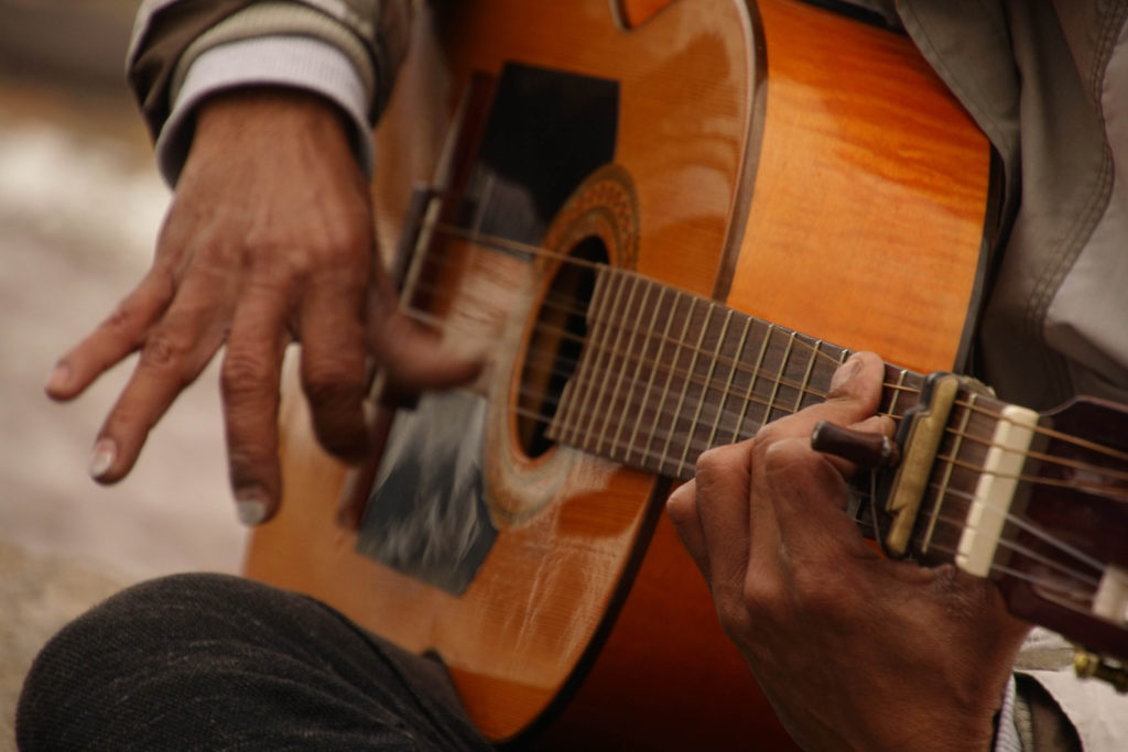 hands and guitar of a flamenco guitarist