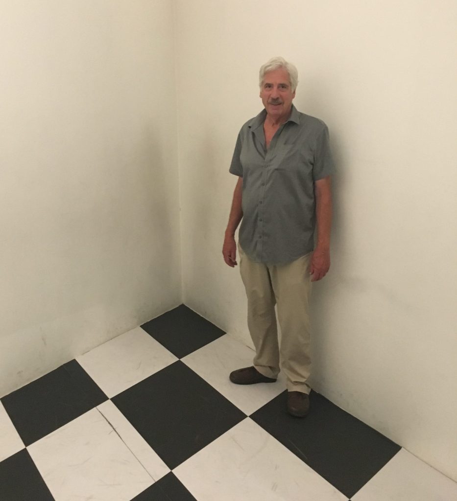 Gregg Simpson in an otpical illusion room at the Escher exhibition in Porto