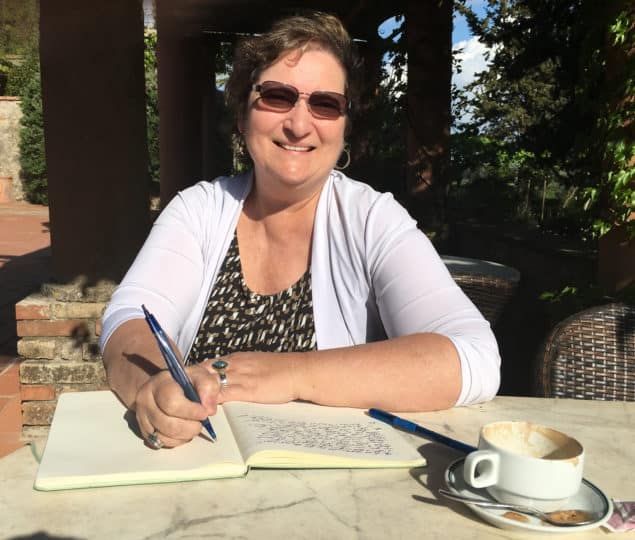 Carol Cram writing in Tuscany