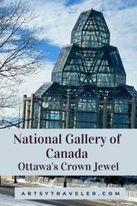 Photo of the glass and steel façade of the National Gallery of Canada with a sign that reads “National Gallery of Canada, Ottawa's Crown Jewel,” and the website "artsytraveler.com" at the bottom.