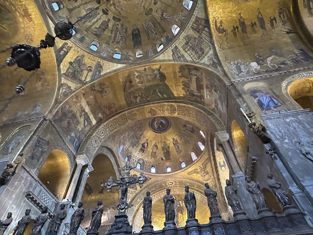 The golden interior of Saint Mark’s Basilica in Venice, adorned with ornate mosaics and sculptures. A short trip from Padua, this is an iconic destination for art and history lovers.