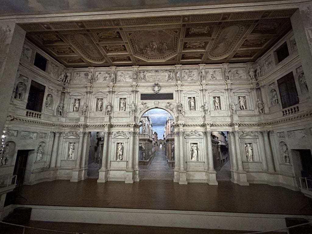 The grand stage of the Teatro Olimpico in Vicenza, showcasing Renaissance-style design and artistic depth. A recommended activity for visitors to Padua interested in architecture and the arts.