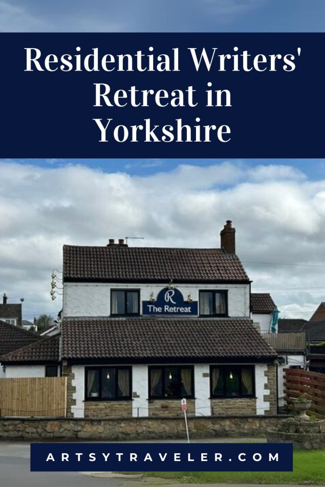 A building labeled “The Retreat” with a white facade and dark roof tiles, advertised as a “Residential Writers’ Retreat in Yorkshire” by ArtsyTraveler.com.