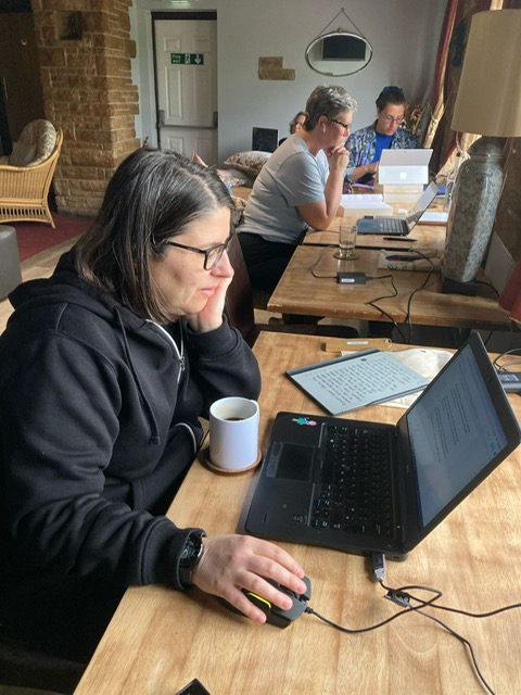 Participants writing at the Writers Retreat in Beal Yorkshire