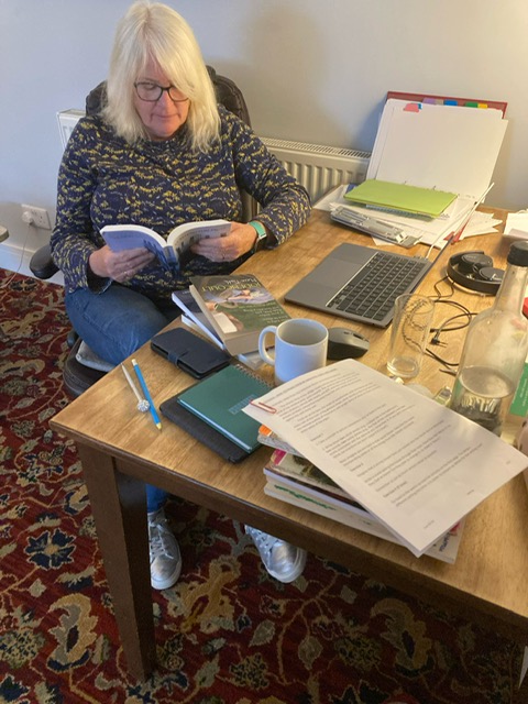 Participant writing at the Writers Retreat in Beal Yorkshire