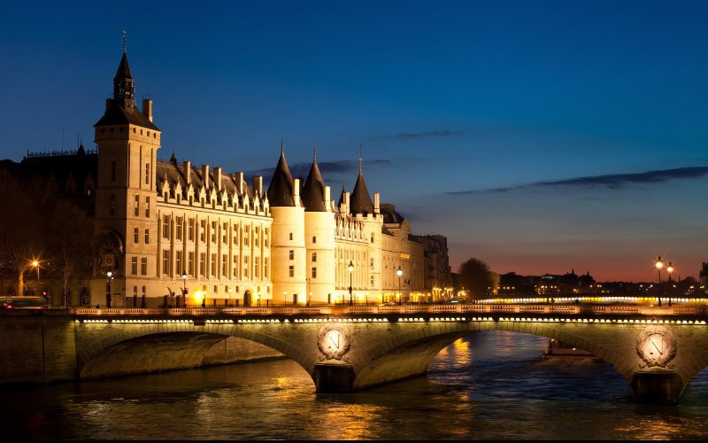 Medieval building floodlit in Paris