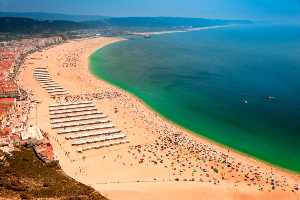 Aerial View of a beach in Portugal during the summer, a great time to travel to Europe.