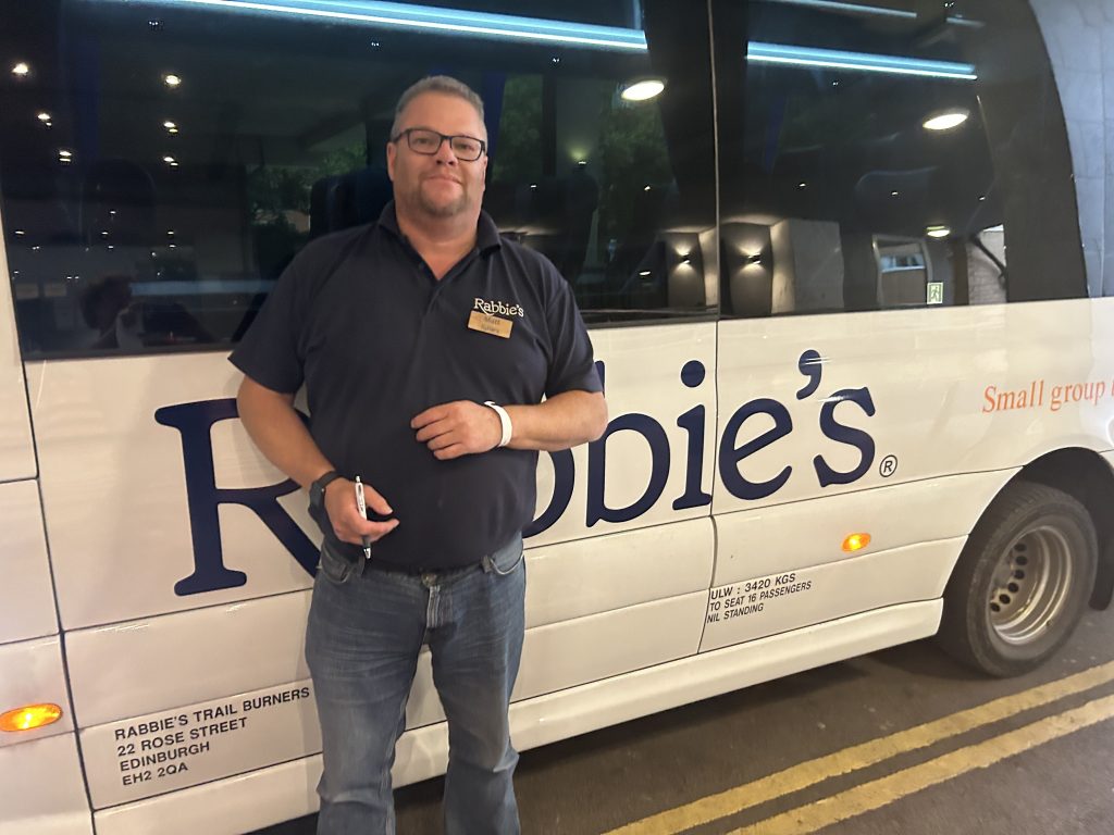 Matt, a guide with Rabbie’s Tours, in front of his van for the multi-day Southwest England tour