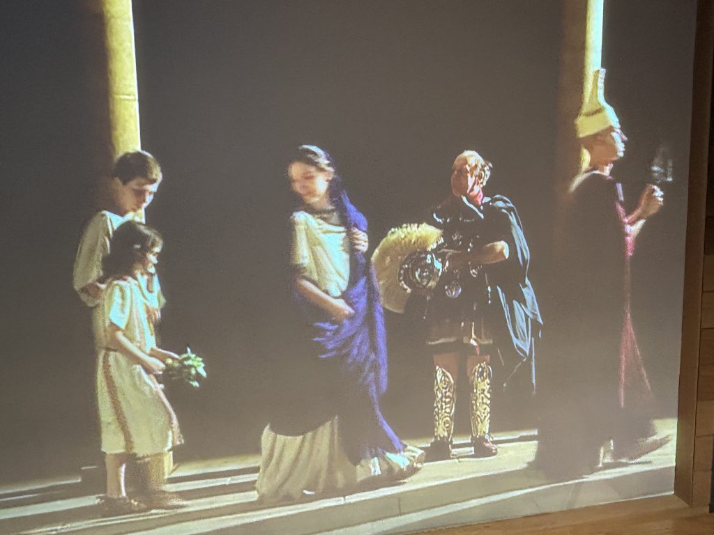 Projection of Roman characters at the Roman Baths Museum in Bath, England