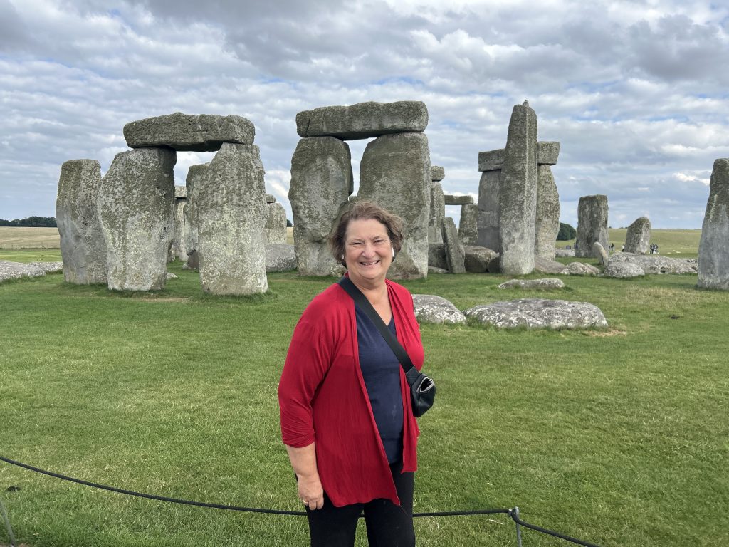 Carol Cram in front of Stonehenge on a Rabbie’s tour of southwest England