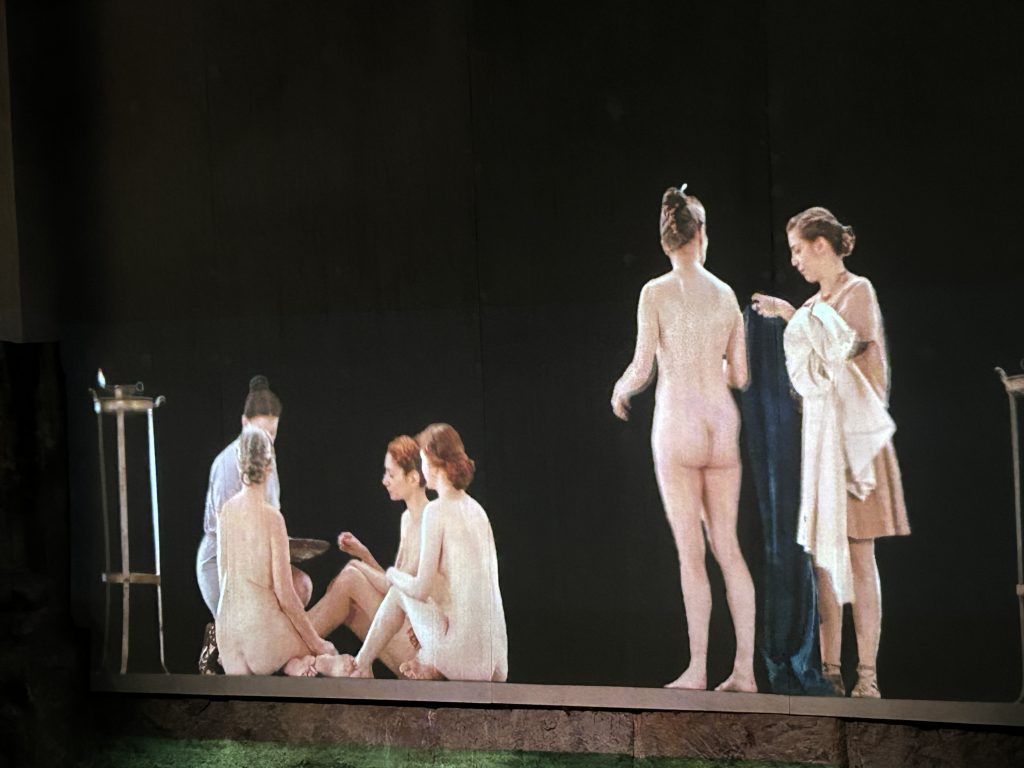 Projection of Romans getting prepared to bathe at the Roman Baths Museum in Bath, England