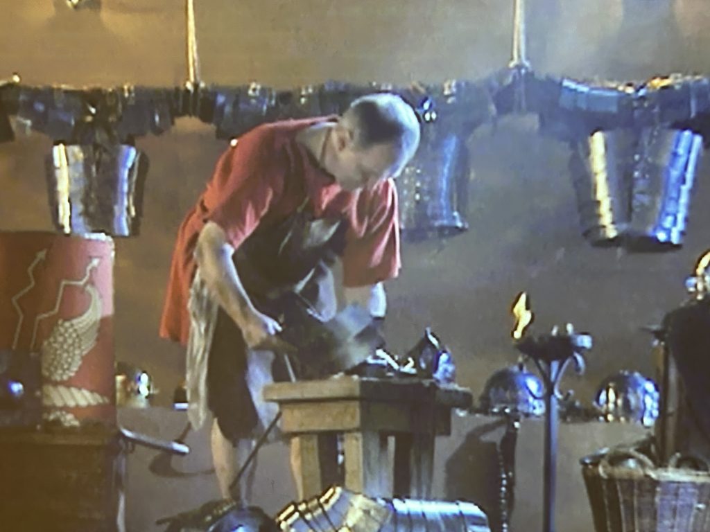 Projection of a Roman blacksmith at the Roman Baths Museum in Bath, England