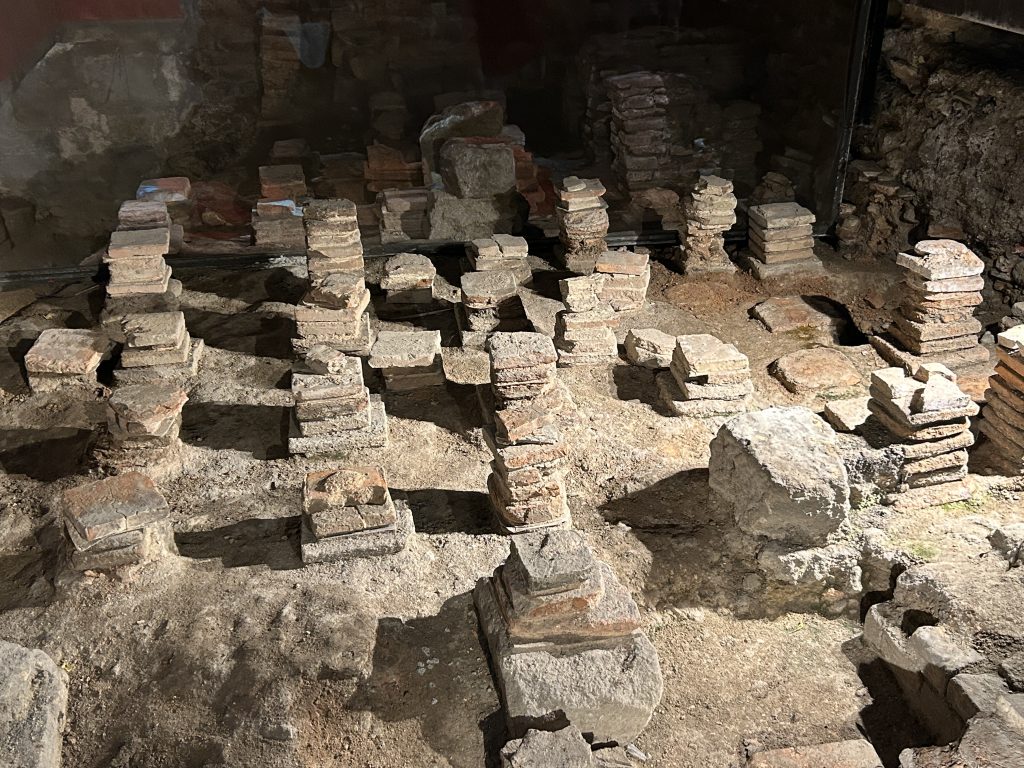 Ruins of the heating system at the Roman Baths Museum in Bath, England