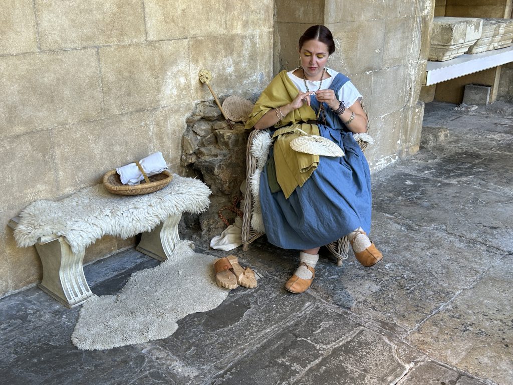 A costumed guide at the Roman Baths Museum in Bath, England