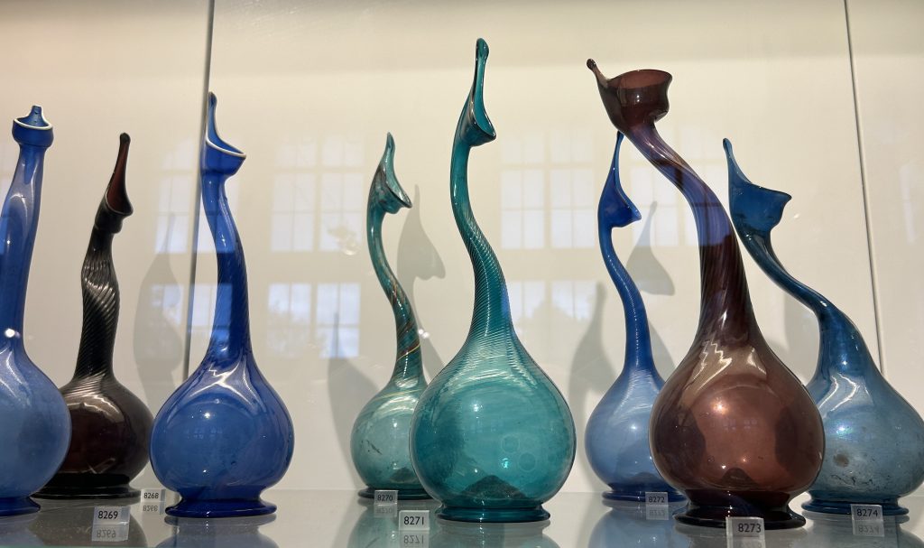 Glass jugs displayed in the Glass Gallery at the Victoria and Albert Museum in London