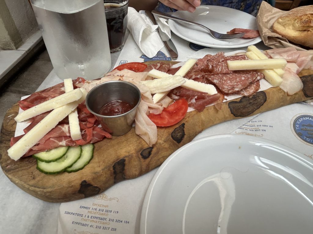 Meat and cheese board at a deli in Monastiraki