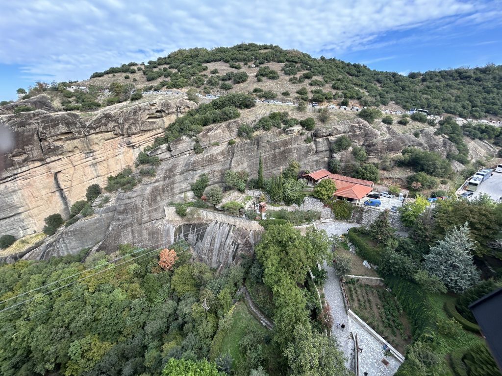 View from a monastery in Meteora showing cars and busses.