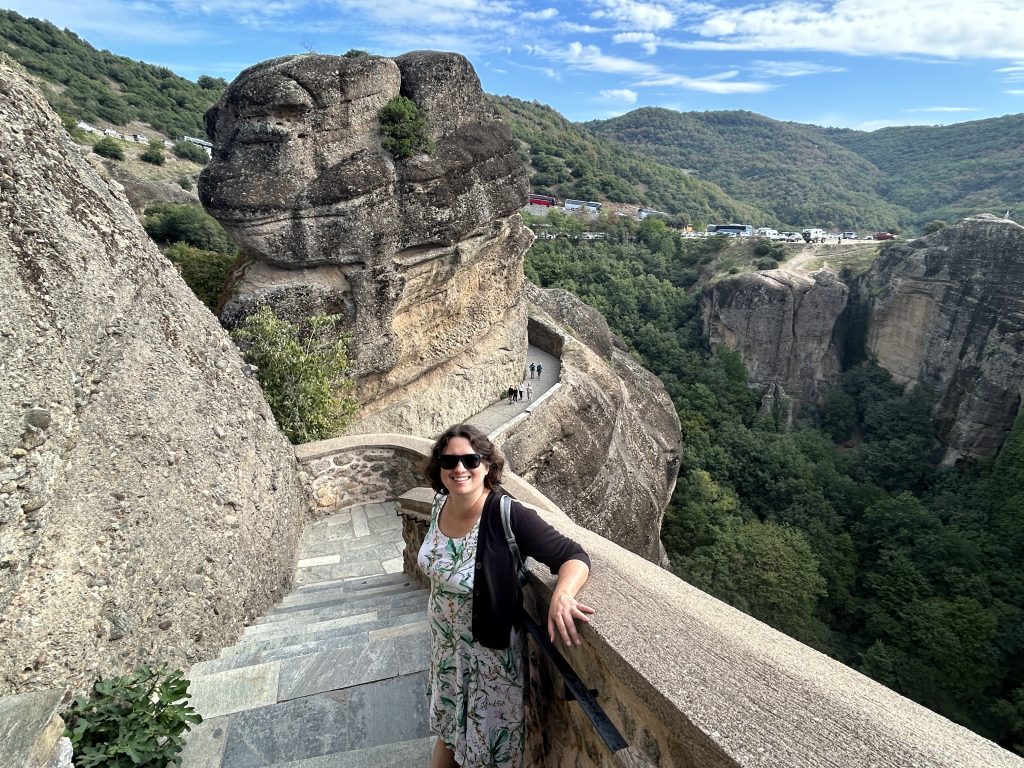 Julia on stairs climbing up to a monastery in Meteora