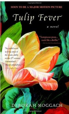 Book cover of Tulip Fever by Deborah Moggach. A close-up of a vibrant red and white tulip with green leaves dominates the cover. A quote in white text praises the novel’s vivid depiction of 17th-century Amsterdam.