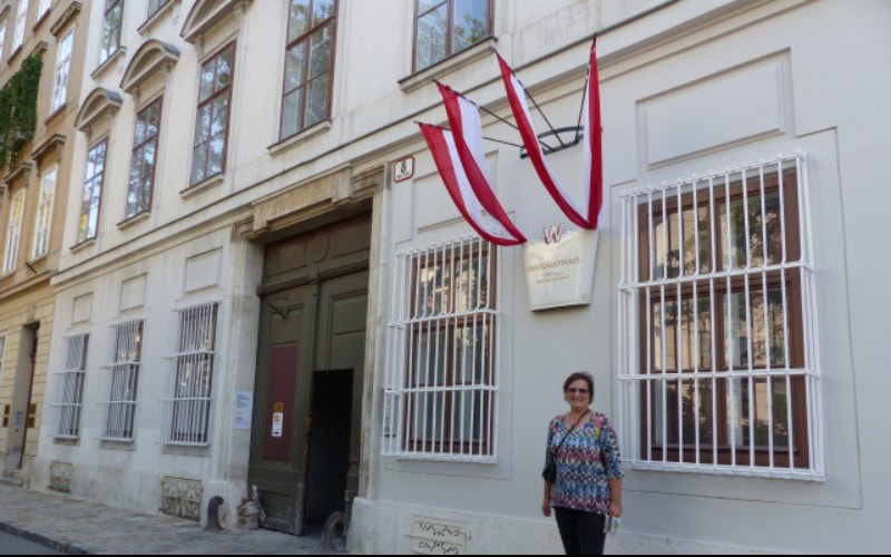 Carol Cram standing in front of one of the houses that Beethoven lived in Vienna, Austria.