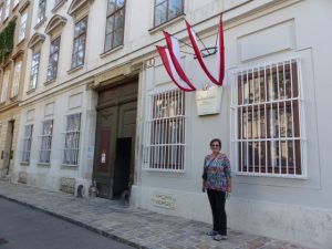 Carol Cram standing in front of one of the houses that Beethoven lived in Vienna, Austria.