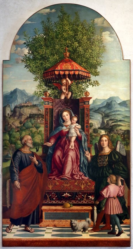 Renaissance painting of the Madonna and Child under a lush canopy, with angels and saints surrounding them in a vibrant pastoral setting.